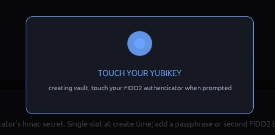 Modal overlay reading 'Touch your YubiKey now' with a small spinning indicator and a Cancel button